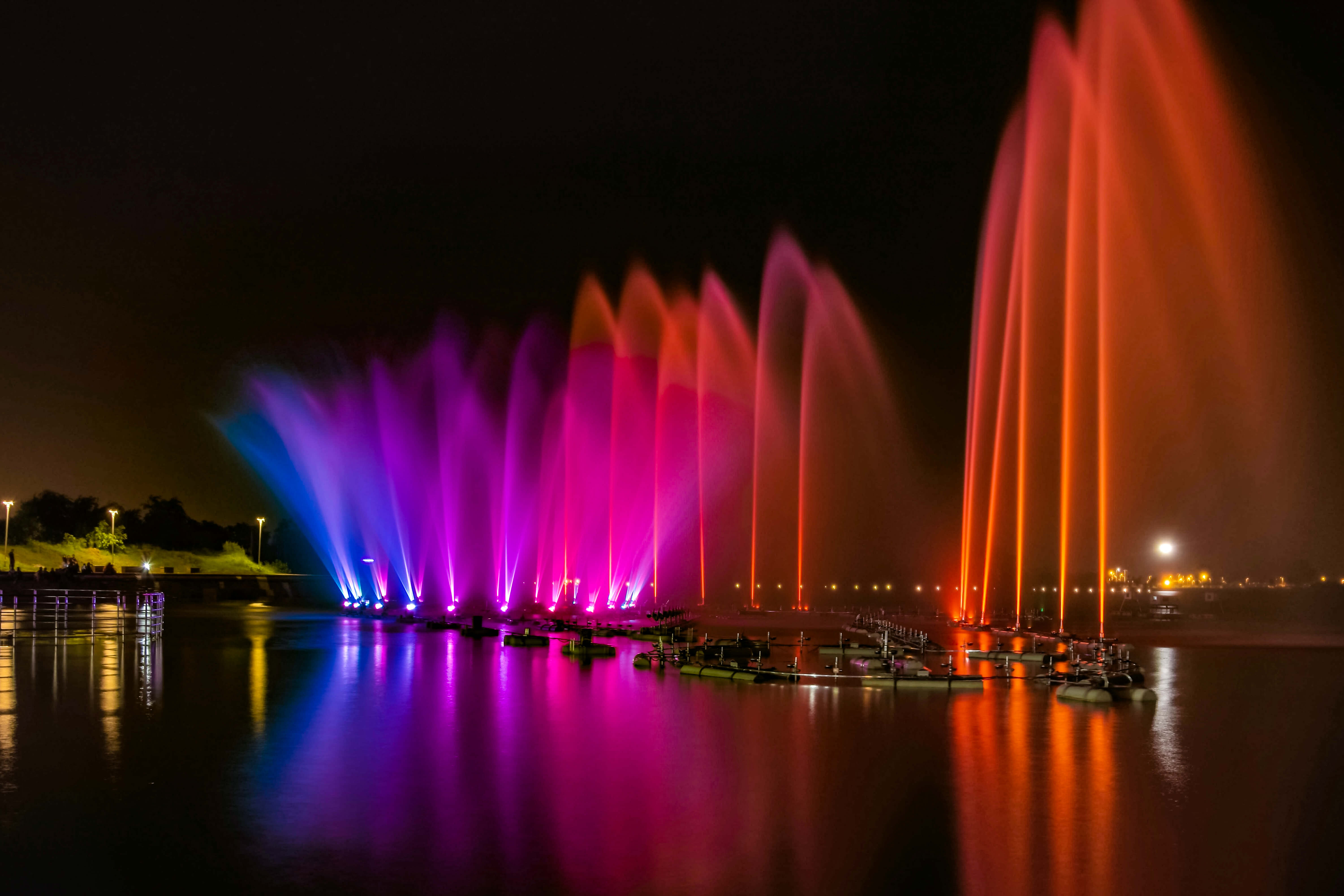 colored water fountain nighttime photography ideas 