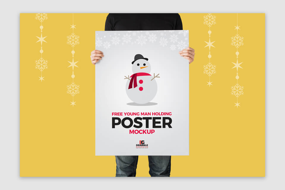 young man holding poster mockup