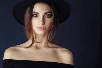 retouchers portfolio portrait of a woman in a black dress on a black background