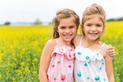 before and after retouch portrait of two girls in the field