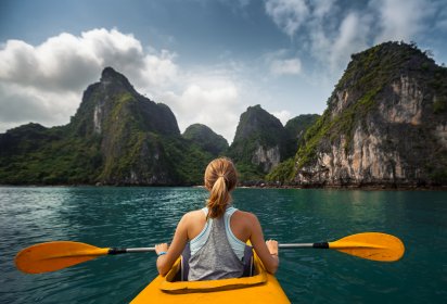 retouched images before and after a girl on a kayak in the lake