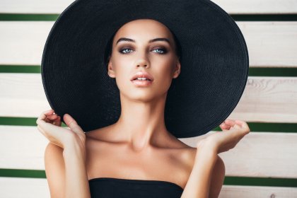 retouched images before and after portrait of a girl in a hat