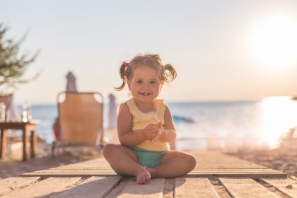 before and after retouching child at sunset