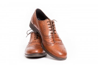 clipping path service brown shoes on white background