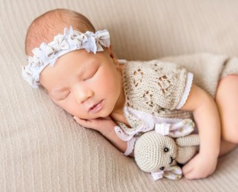 baby photo retouching photoshop sleeping newborn with toy